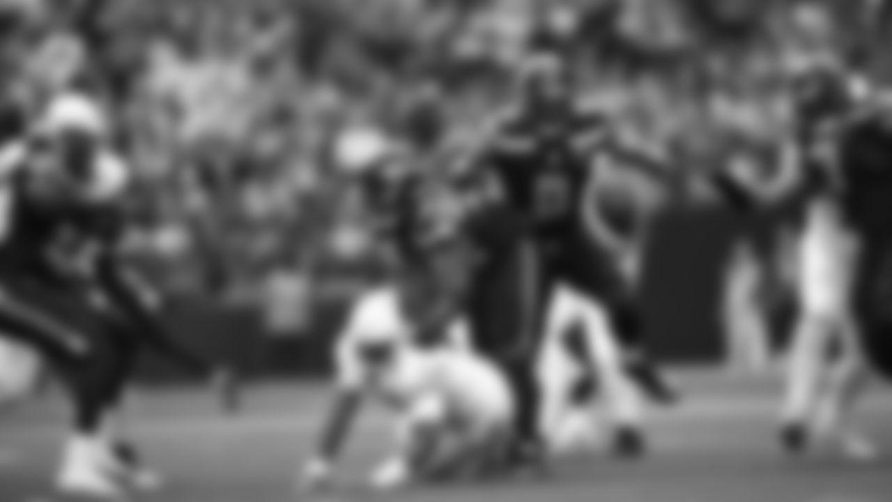 Seahawks linebacker Tyrice Knight (48) sacks Cardinals QB Jacoby Brissett and defensive end DeMarcus Lawrence (0) scoops the ball up and scores the touchdown.