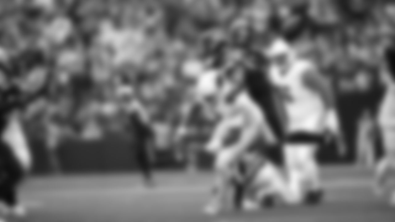 Seahawks linebacker Tyrice Knight (48) sacks Cardinals QB Jacoby Brissett and defensive end DeMarcus Lawrence (0) scoops the ball up and scores the touchdown.