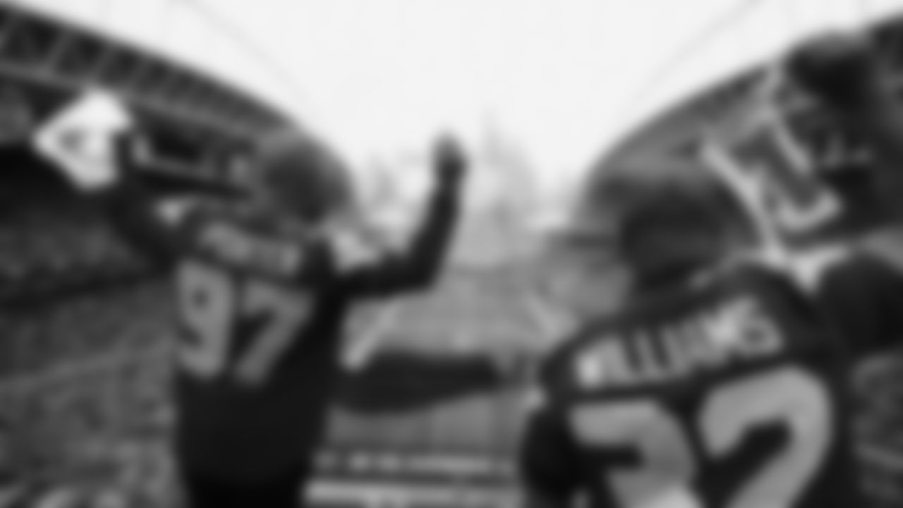 Seahawks Legends Rufus Porter and John L. Williams raise 12 flag in week 15 on December 14, 2025