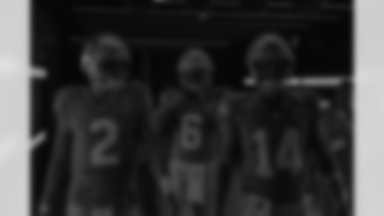 Seahawks quarterback Drew Lock (2), quarterback Jalen Milroe (6) and quarterback Sam Darnold (14) walks through the Emerald Queen Casino tunnel club at Lumen Field for the Week 5 matchup vs. the Buccaneers.