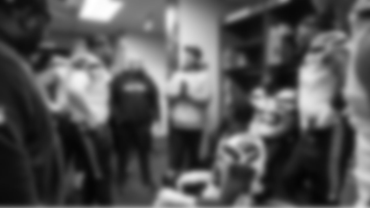 Defensive coordinator Aden Durde talks to players during halftime.