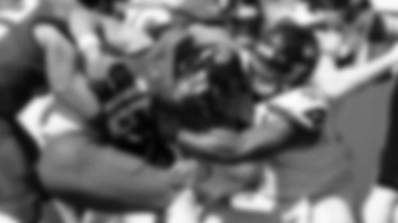 Seahawks defensive lineman Byron Murphy II sacks Jaguars quarterback Trevor Lawrence.