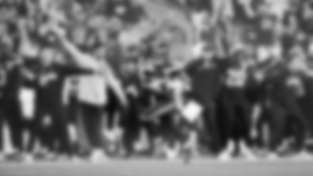 The Seahawks sideline reacts as returner Rashid Shaheed speeds by them on a 95-yard kickoff return for a touchdown to open the game.