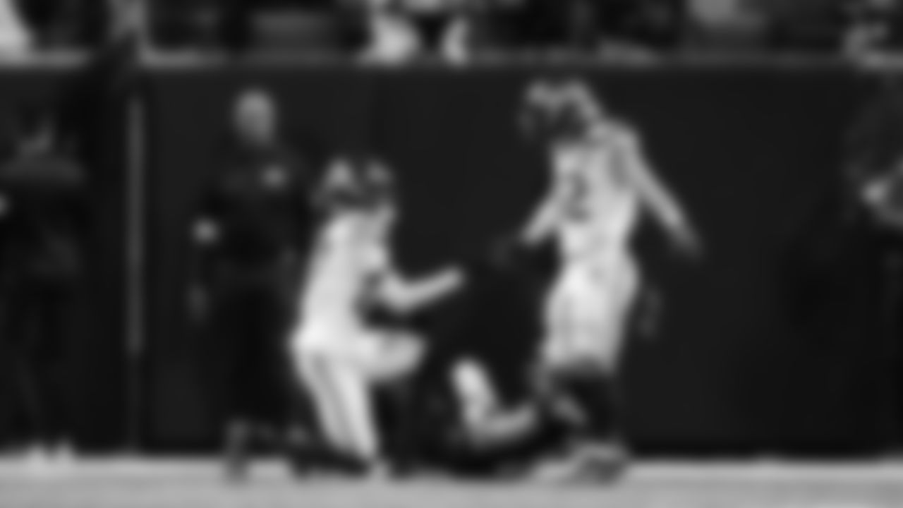 Seahawks cornerback Riq Woolen had two passes defensed on the day and is congratulated by linebacker Drake Thomas.