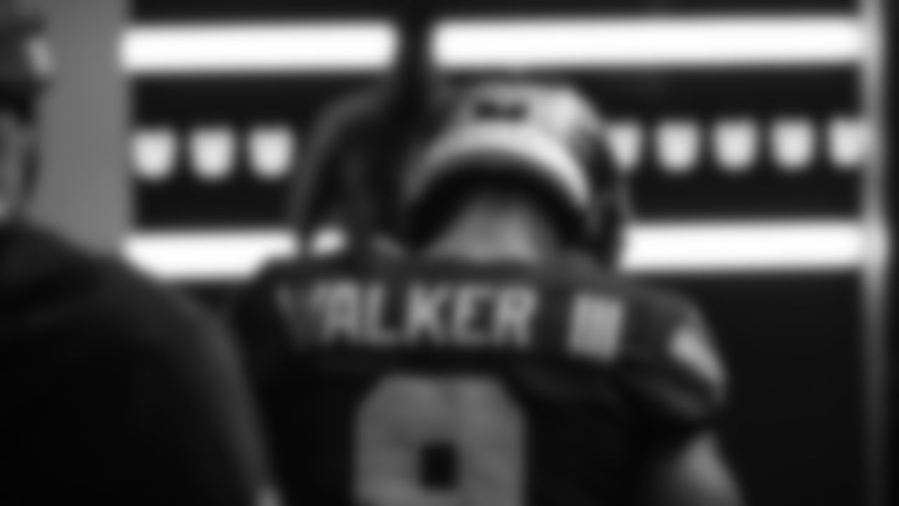 Seahawks running back Kenneth Walker III (9) walks through the Emerald Queen Casino tunnel club at Lumen Field for the Week 10 matchup vs. the Cardinals.