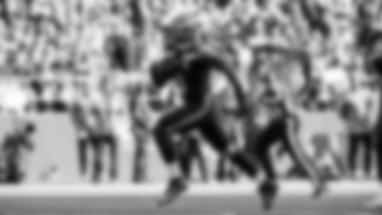 Seahawks linebacker Tyrice Knight (48) sacks Cardinals QB Jacoby Brissett and defensive end DeMarcus Lawrence (0) scoops the ball up and scores the touchdown.