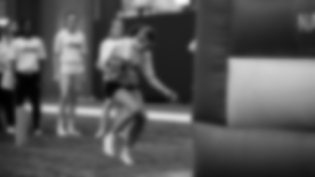 The Seahawks Women's Association packed girls flag kits and hosted a free girls flag football camp at the Seahawks training facility on Saturday, November 8, 2025.