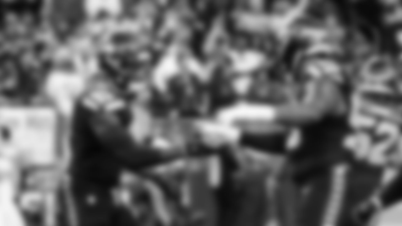 Seahawks DeMarcus Lawrence and Leonard Williams on the field during pregame warmups.