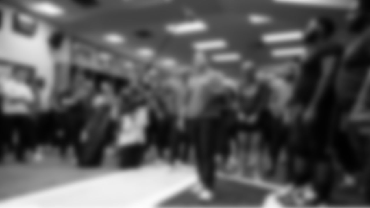 In the locker room, head coach Mike Macdonald addresses the Seahawks players and coaches after the game.