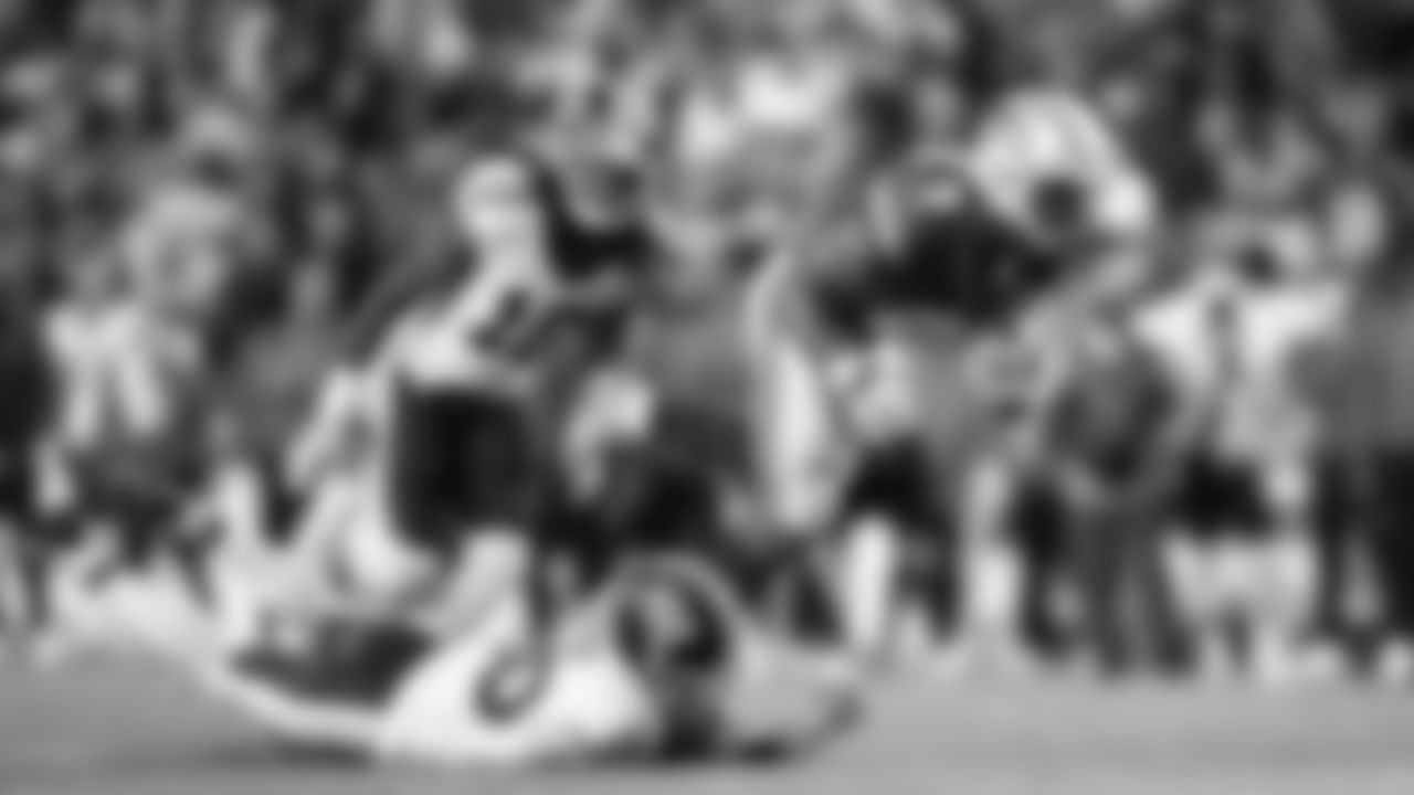 Seahawks running back Kenneth Walker III stretches for extra yardage.