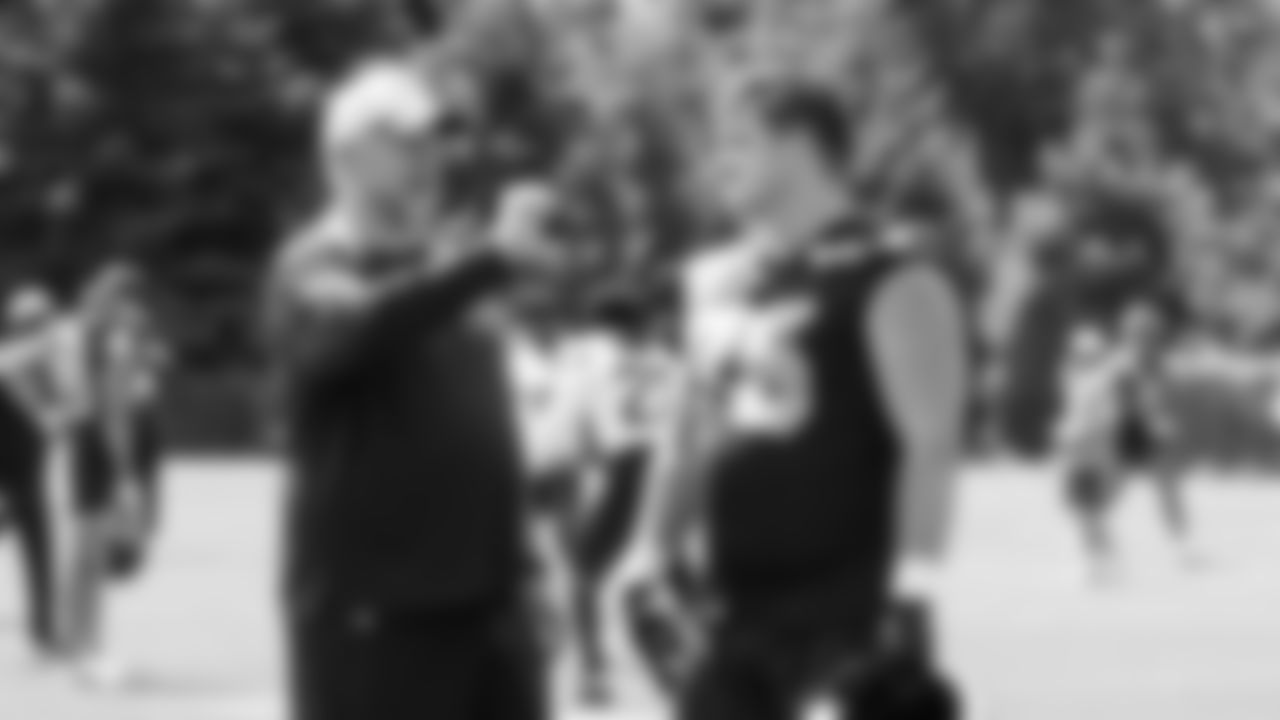 Seahawks guard Grey Zabel (76) with offensive line coach John Benton on day four of OTAs on Monday, June 2, 2025 at the Virginia Mason Athletic Center.