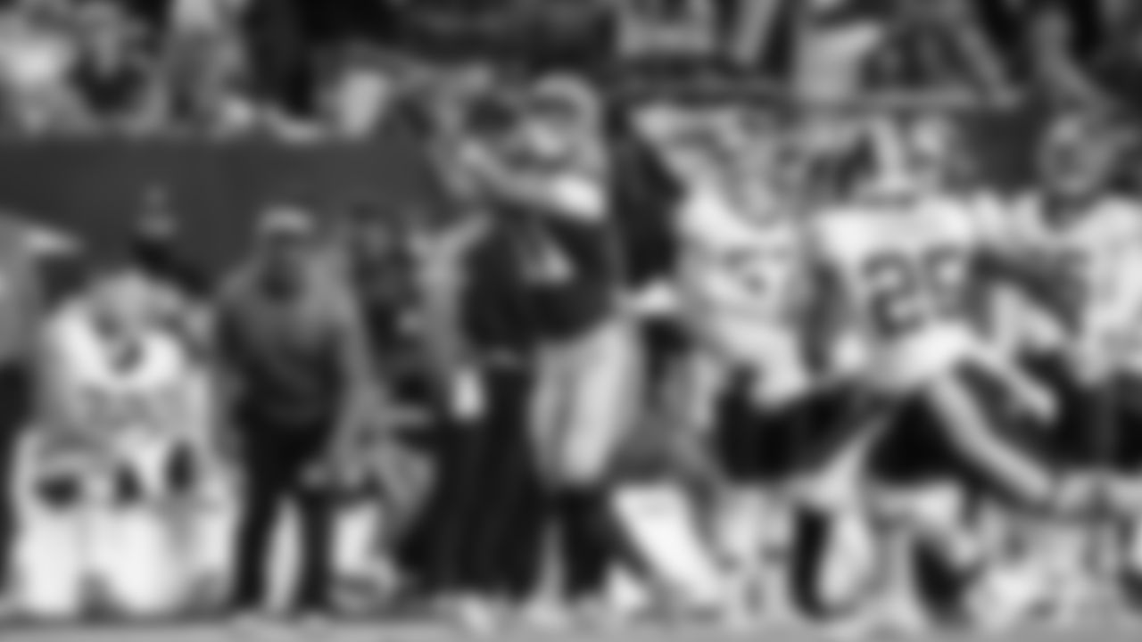 Seahawks receiver Jaxon Smith-Njigba reaches out to haul in a long pass from Sam Darnold setting up a field goal at the end of the first half.