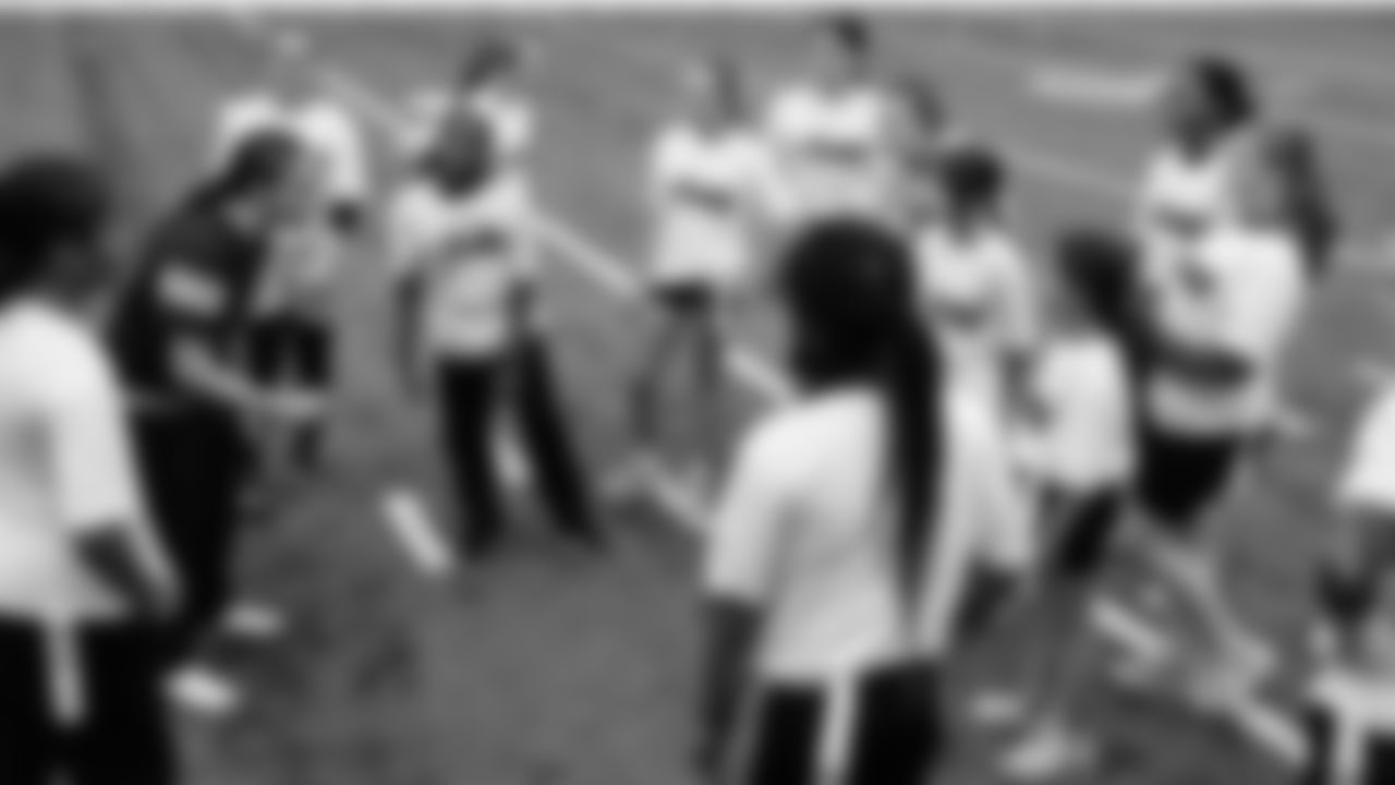 The Seahawks Women's Association packed girls flag kits and hosted a free girls flag football camp at the Seahawks training facility on Saturday, November 8, 2025.