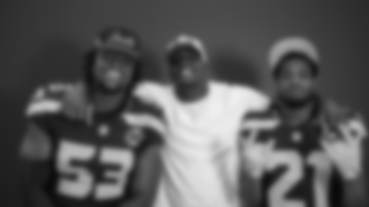 Seahawks linebacker Boye Mafe (53), linebacker Derick Hall (58) and cornerback Devon Witherspoon (21) at Seahawks media day on June 9, 2025