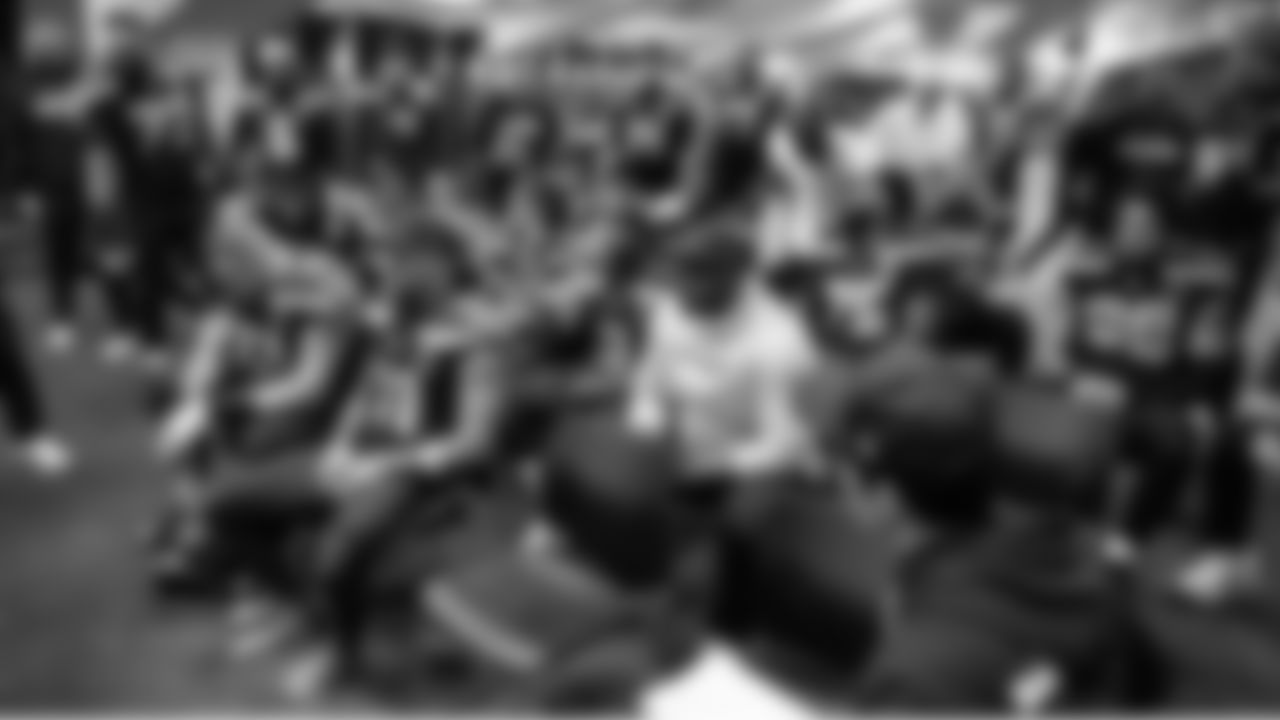 At halftime, members of the Seahawks offense take a break while waiting to hear from offensive coordinator Klint Kubiak.