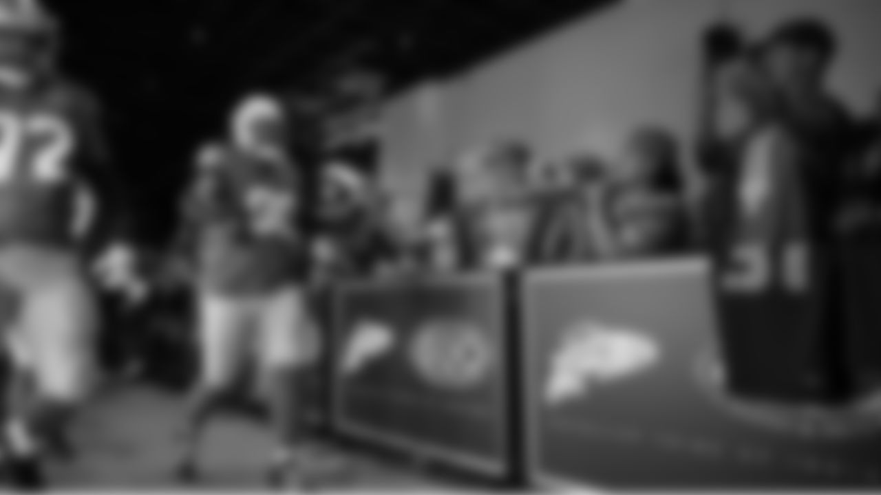 Seahawks defensive tackle Jarran Reed (90) walks through the Emerald Queen Casino tunnel club at Lumen Field for the Week 5 matchup vs. the Buccaneers.