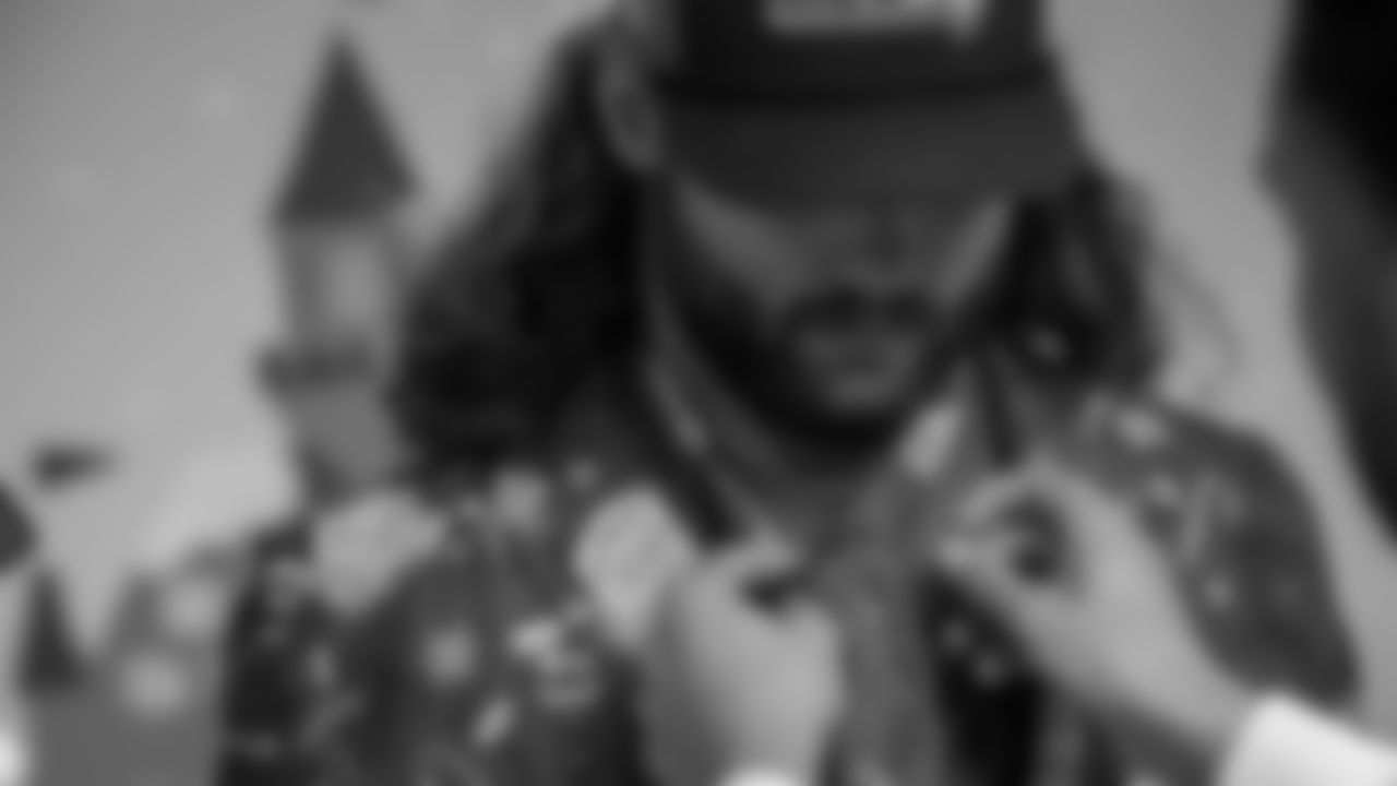 Seahawks Fullback Brady Russell, the Seahawks Dancers, and Blitz spent the day volunteering at Santa's Castle on Joint Base Lewis-McChord to celebrate the holidays and support service members and their families.