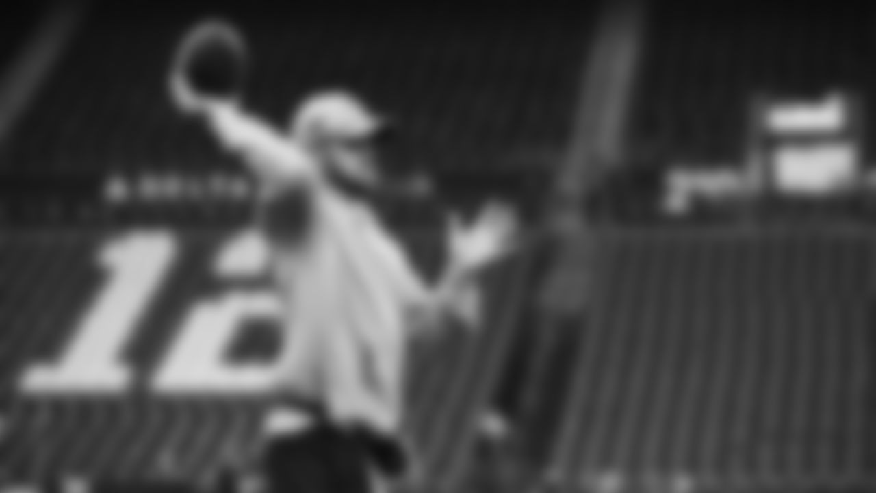 Seahawks quarterback Sam Darnold (14) warms up at Lumen Field for the Week 16 matchup vs. the L.A. Rams.