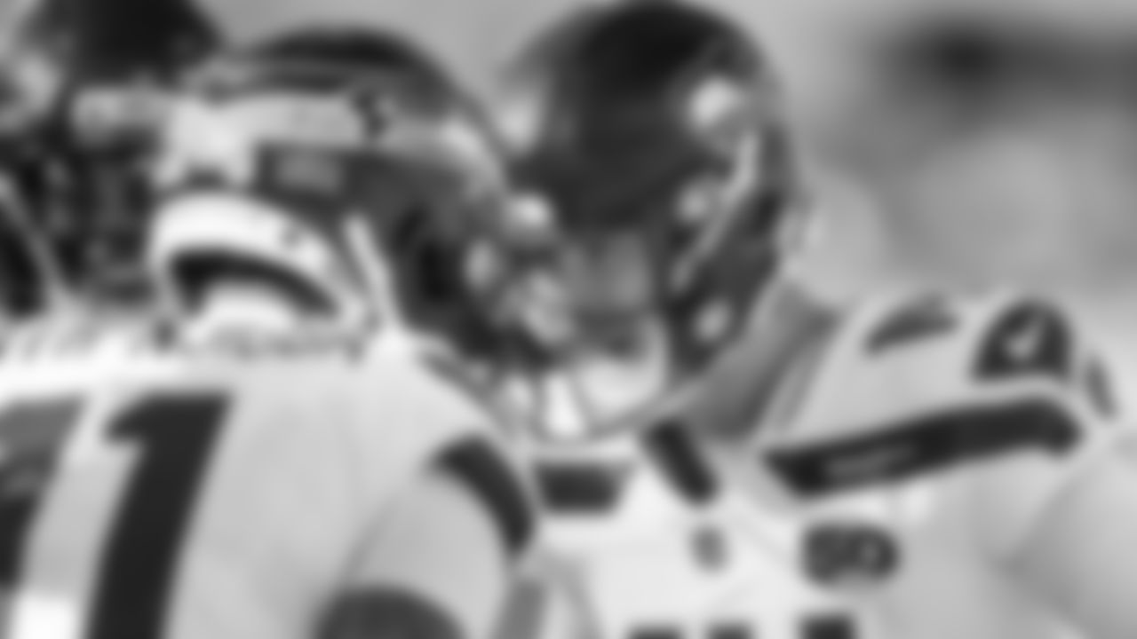 Quarterback Sam Darnold celebrates with receiver Jaxon Smith-Njigba after the pair connected for their second touchdown of the game.