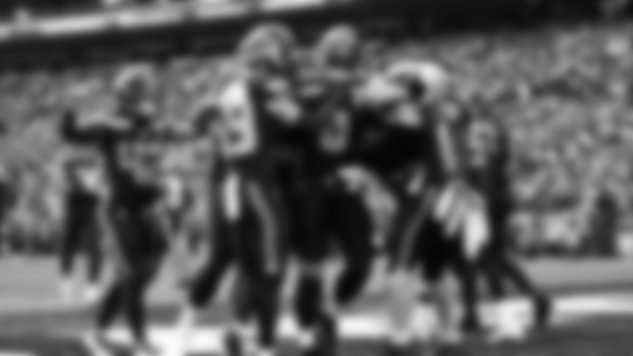 Seahawks linebacker Tyrice Knight (48) sacks Cardinals QB Jacoby Brissett and defensive end DeMarcus Lawrence (0) scoops the ball up and scores the touchdown.