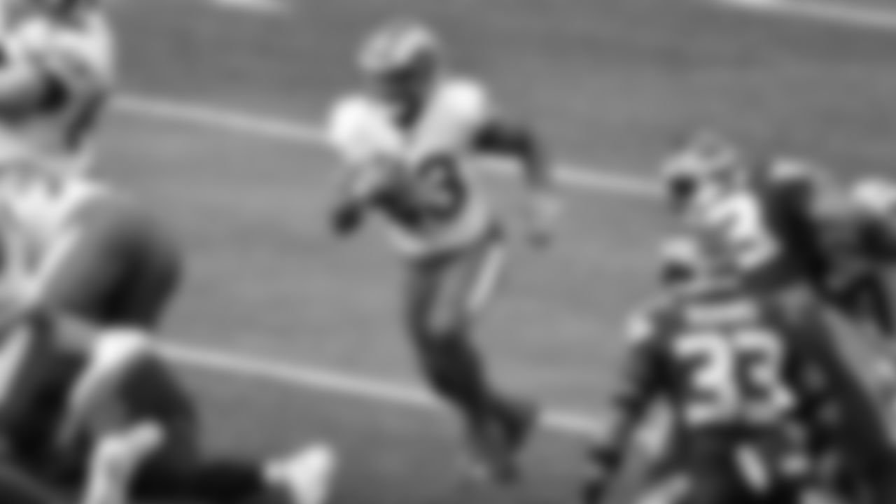 Los Angeles Rams running back Cam Akers (23) runs the ball during an NFL Wild Card football game against Seattle Seahawks, Saturday, Jan. 9, 2021 in Seattle. The Rams defeated the Seahawks 30-20. (Alika Jenner via AP)