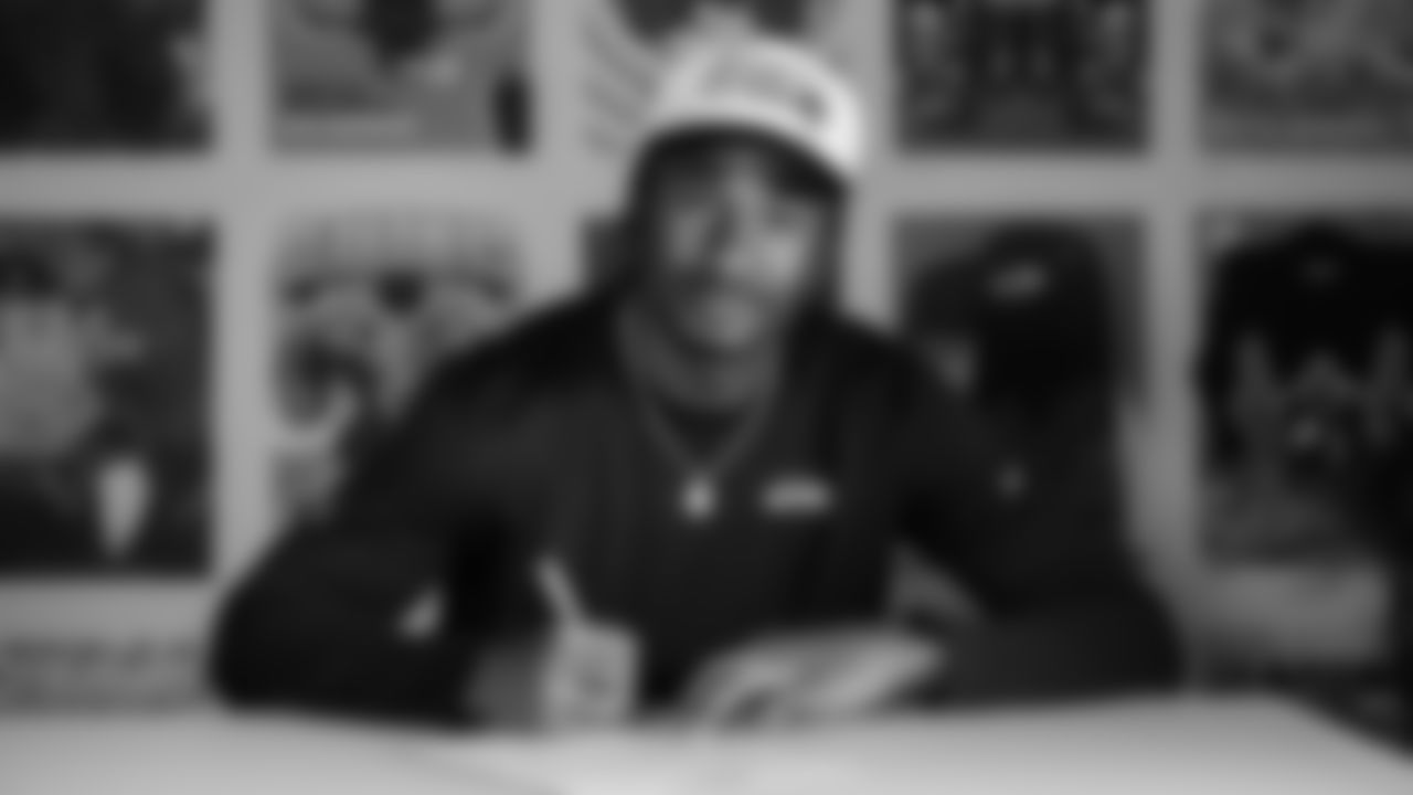 Seahawks wide receiver Tory Horton (15) signed his rookie contract on May 12, 2025 at the Virginia Mason Athletic Center.