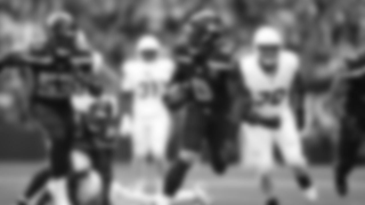 Seahawks linebacker Tyrice Knight (48) sacks Cardinals QB Jacoby Brissett and defensive end DeMarcus Lawrence (0) scoops the ball up and scores the touchdown.