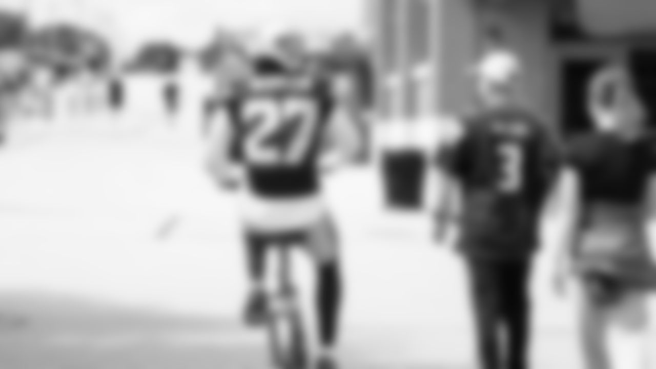 Seahawks cornerback Riq Woolen (27) rides a bike on their way to practice on August 21, 2025 in Green Bay, Wisconsin.