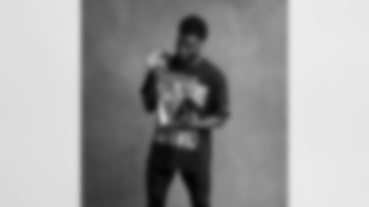 Seahawks cornerback Devon Witherspoon (21) with the Lombardi Trophy after winning Super Bowl LX.