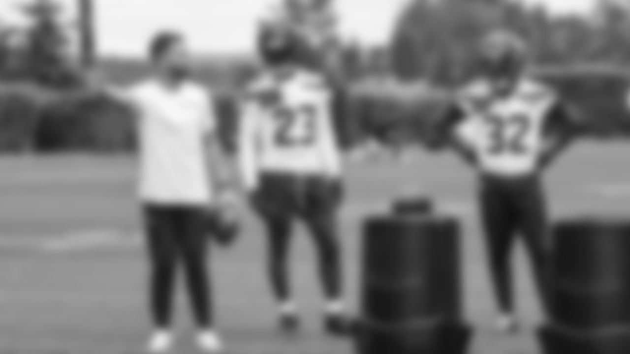 Seahawks safeties coach Jeff Howard with safety D'Anthony Bell (23) and safety Jerrick Reed II (32) on day five of OTAs on Wednesday, June 4, 2025 at the Virginia Mason Athletic Center.