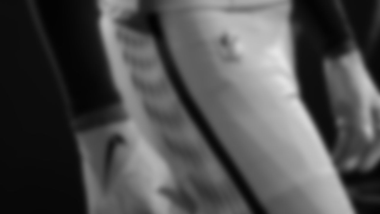 The soundwave pattern continues down the pant leg, fueling the players and driving that energy throughout the stadium.