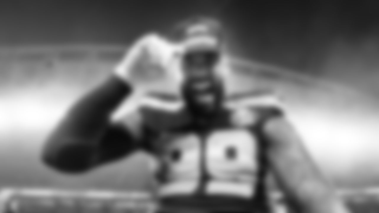 Seattle's Leonard Williams shows off his NFC Champions cap after the win.