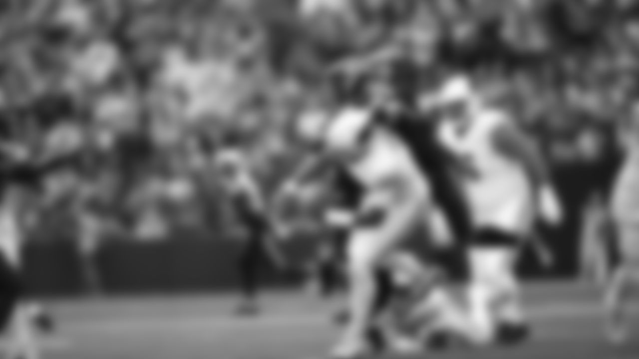 Seahawks linebacker Tyrice Knight (48) sacks Cardinals QB Jacoby Brissett and defensive end DeMarcus Lawrence (0) scoops the ball up and scores the touchdown.