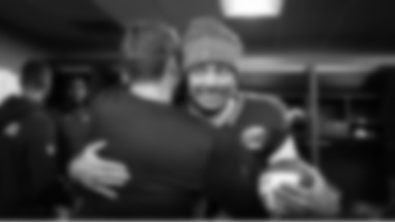 In the victorious locker room, Jaxon Smith-Njigba is all smiles after receiving a Player of the Game ball from NBC's Sunday Night Football.