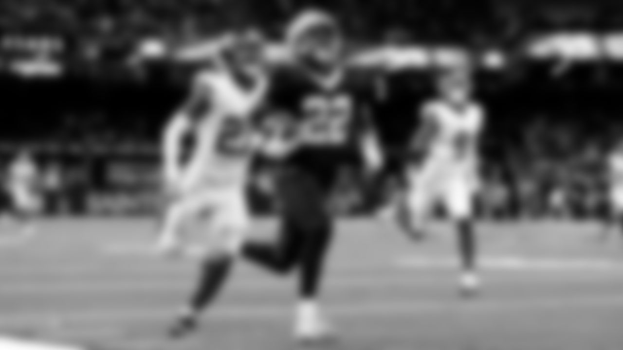 New Orleans Saints wide receiver Rashid Shaheed (22) runs past New York Giants safety Tyler Nubin (27) to score a touchdown during an NFL football game, Sunday, Oct. 5, 2025, in New Orleans. (AP Photo/Tyler Kaufman)