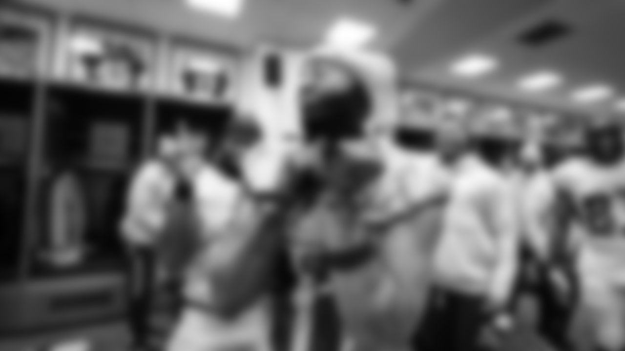 Seahawks receiver Jaxon Smith-Njigba and Kenneth Walker III dance in the locker room after the win.