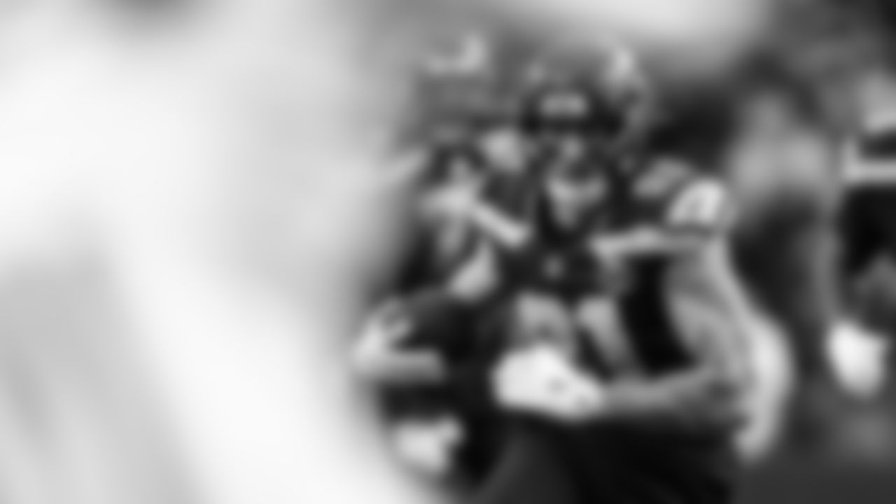 Seahawks tight end Eric Saubert looks for running room after the catch.