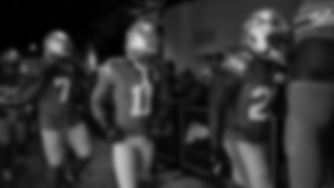 Seahawks wide receiver Jaxon Smith-Njigba (11) walks through the Emerald Queen Casino tunnel club at Lumen Field for the Week 13 matchup vs. the Vikings.