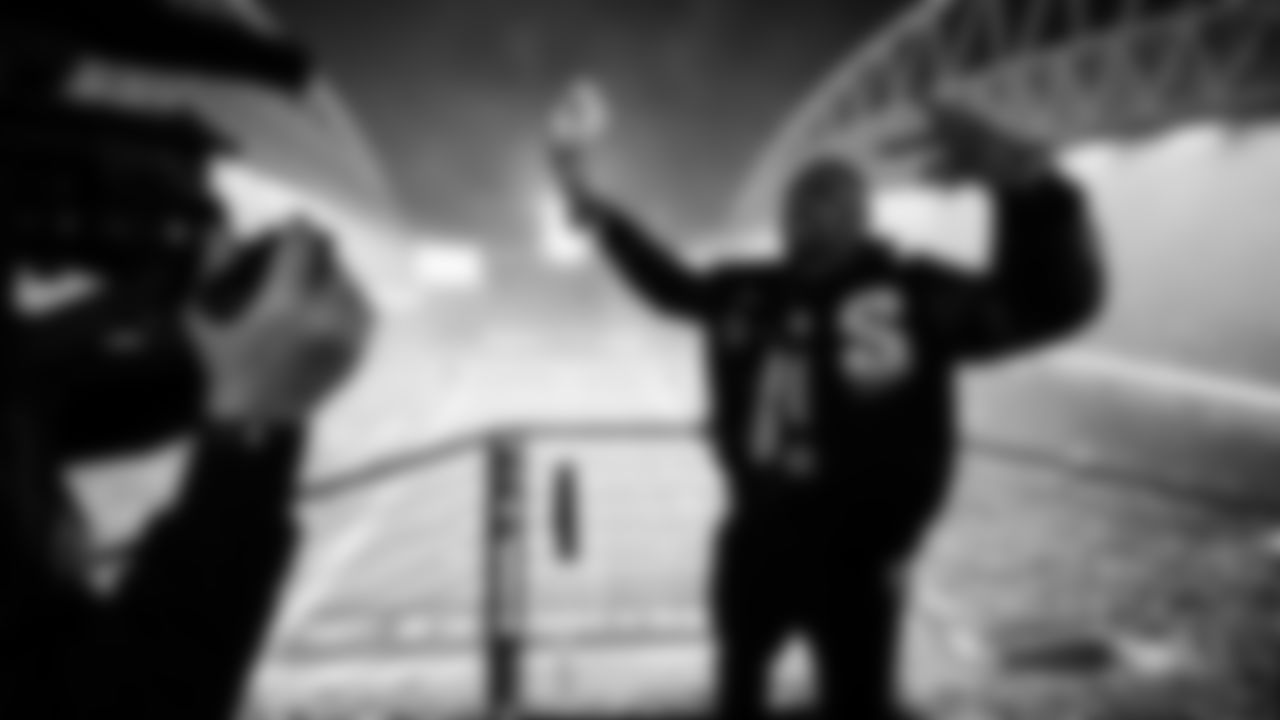 Seahawks Legend Doug Baldwin raising the flag in the 2025 Divisional Round on January 17, 2025.