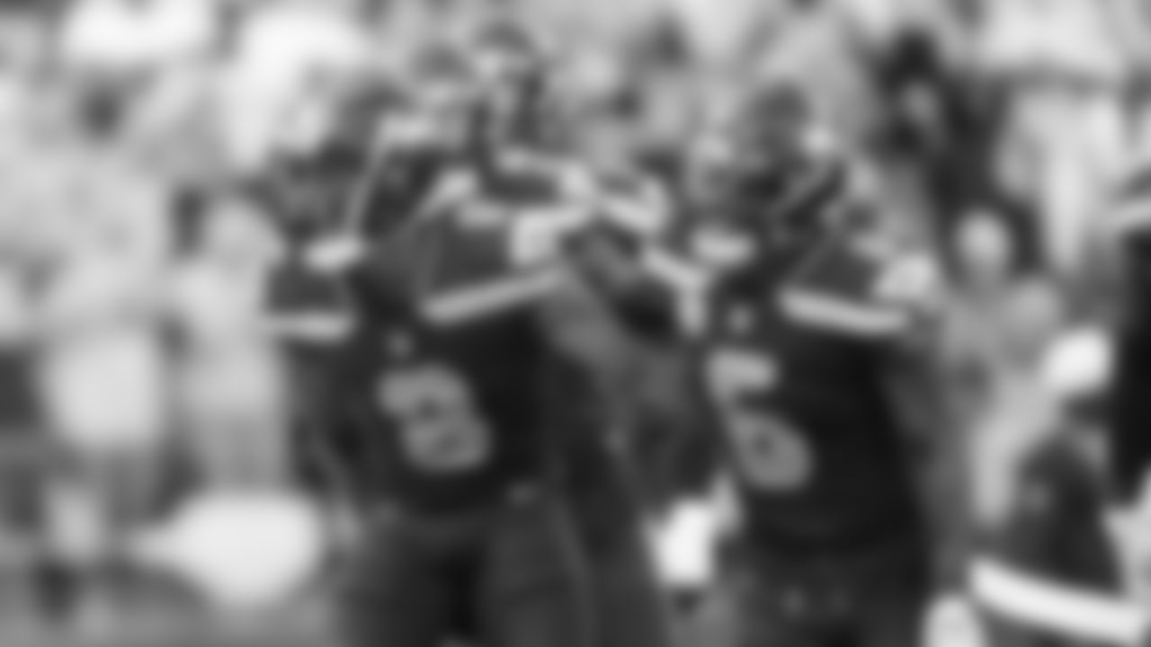 Coby Bryant celebrates with Quandre Diggs after Bryant's fourth forced fumble in four games.