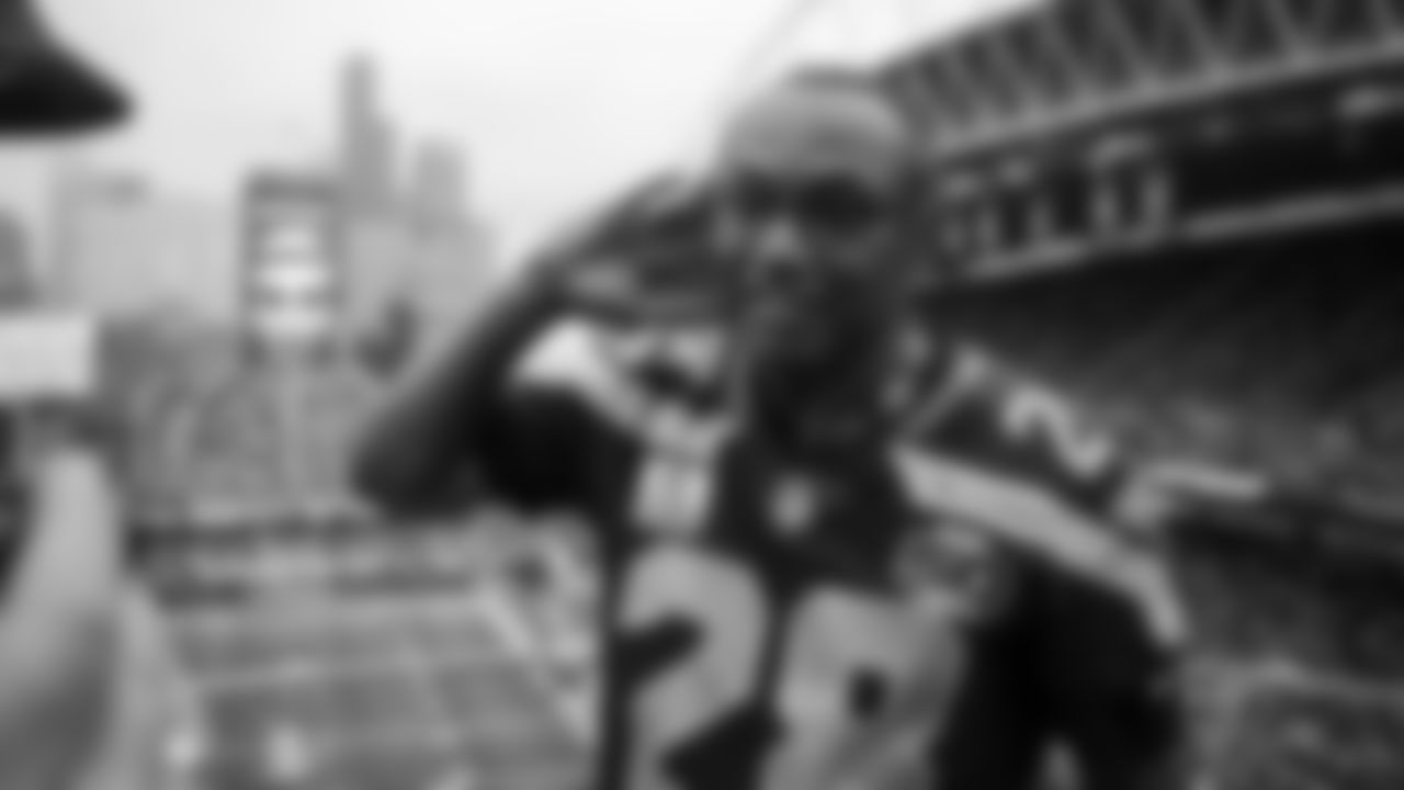 Seahawks Legend Curt Warner raises the 12 Flag before the 2nd preseason game against the Chiefs on August 15th.
