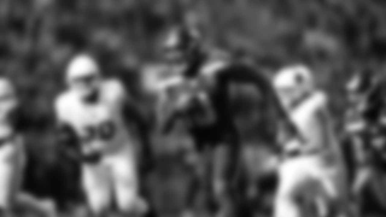 Seahawks linebacker Tyrice Knight (48) sacks Cardinals QB Jacoby Brissett and defensive end DeMarcus Lawrence (0) scoops the ball up and scores the touchdown.