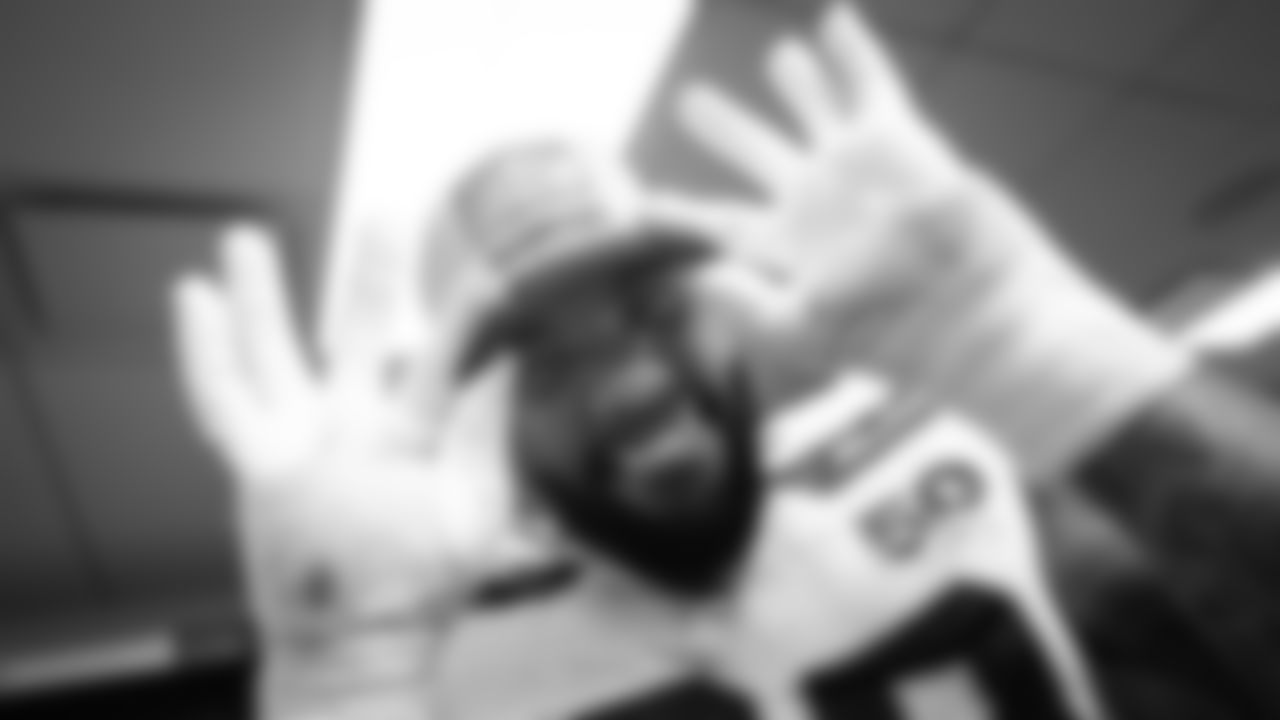 Seahawks defensive tackle Leonard Williams shows off his NFC West Champions hat.