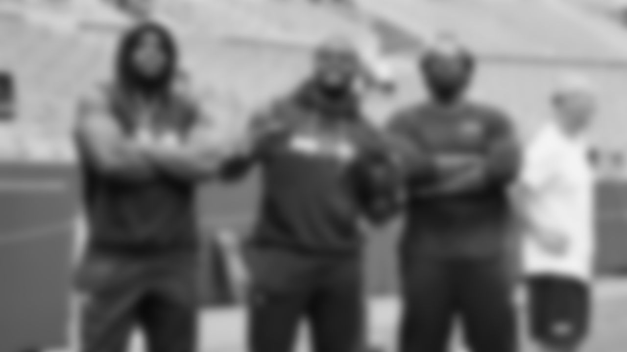 Seahawks linebacker Boye Mafe (53), linebacker Derick Hall (58) and defensive end DeMarcus Lawrence (0) warm up at Lambeau Field for the preseason Week 3 matchup vs. the Green Bay Packers.