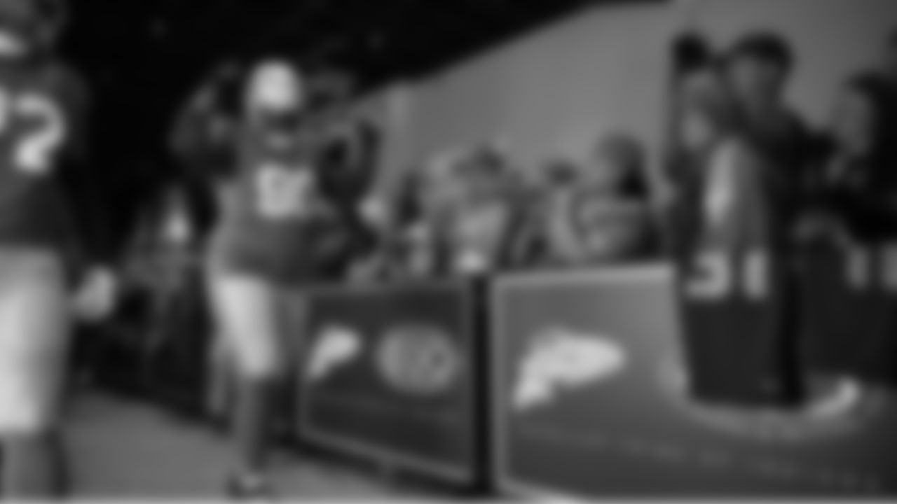 Seahawks defensive tackle Jarran Reed (90) walks through the Emerald Queen Casino tunnel club at Lumen Field for the Week 5 matchup vs. the Buccaneers.