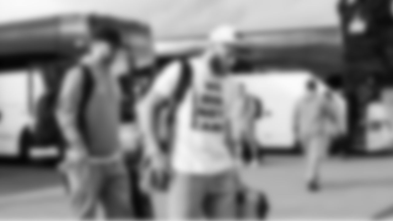 Seahawks receiver Cooper Kupp wears a "We. Did. Not. Care." t-shirt as the team boards the charter headed for San Jose. The quote was originally said by head coach Mike Macdonald in response to a media question after the NFC Championship Game.