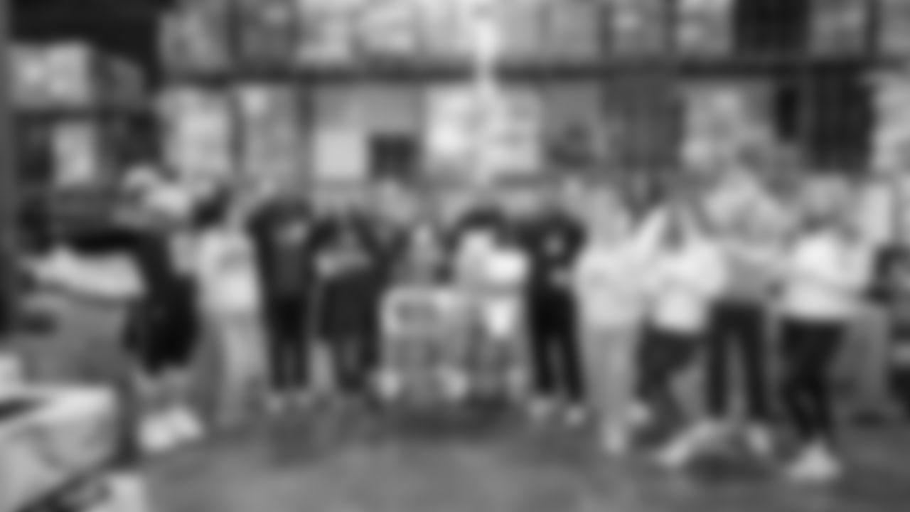 Seahawks Legend Bryan Walters, Dancers, Blitz and volunteers helped sort 4,800 pounds of action green apples at the Food Lifeline distribution center on January 22, 2026.