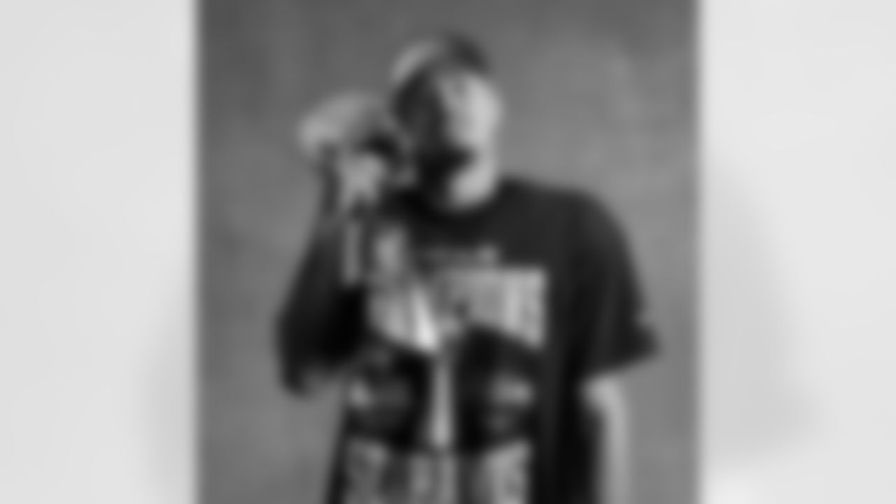 Seahawks wide receiver Jaxon Smith-Njigba (11) with the Lombardi Trophy after winning Super Bowl LX.