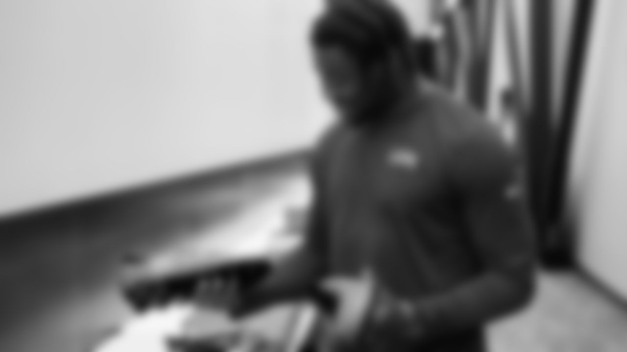 Seahawks quarterback Jalen Milroe (6) unboxed his My Cause My Cleats at the Virginia Mason Athletic Center.