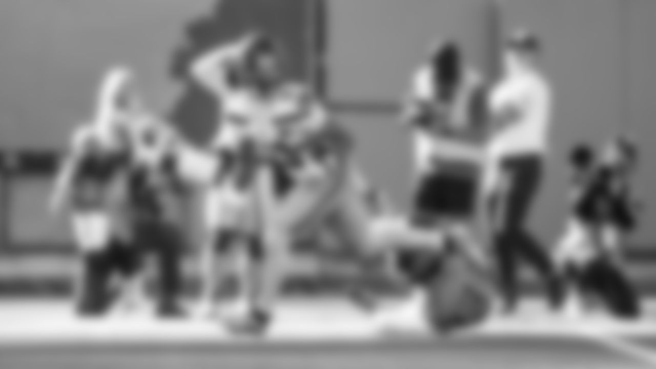 Receiver Jaxon Smith-Njigba dances away from a defender on his way to a 63-yard touchdown from Sam Darnold.